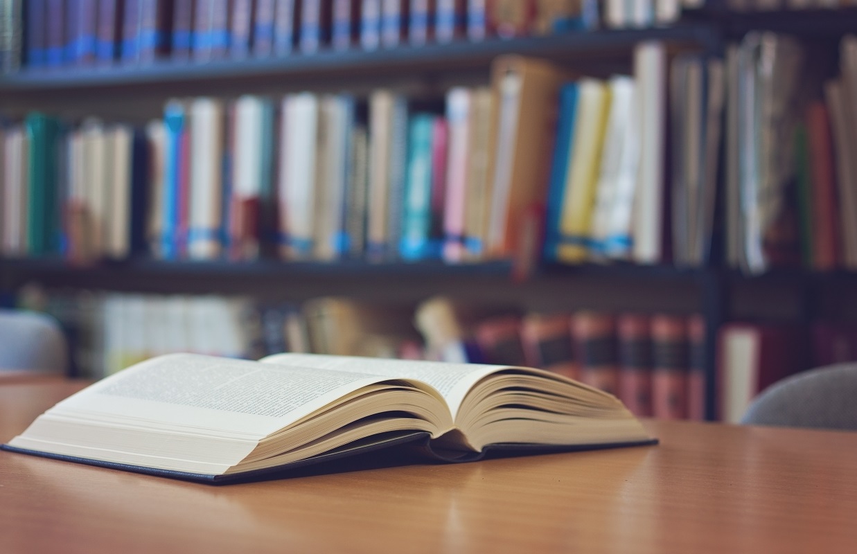 Open book on a desk in a library